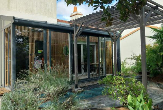 Réalisation d'une véranda Gustave Rideau à Beautour pour Najat et Olivier